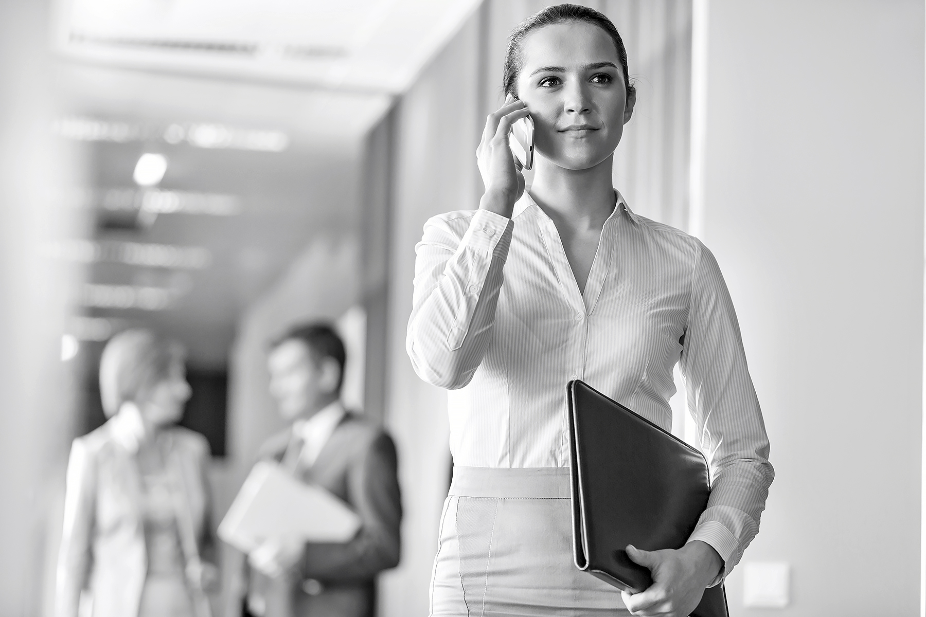 Female professional speaking on the phone.